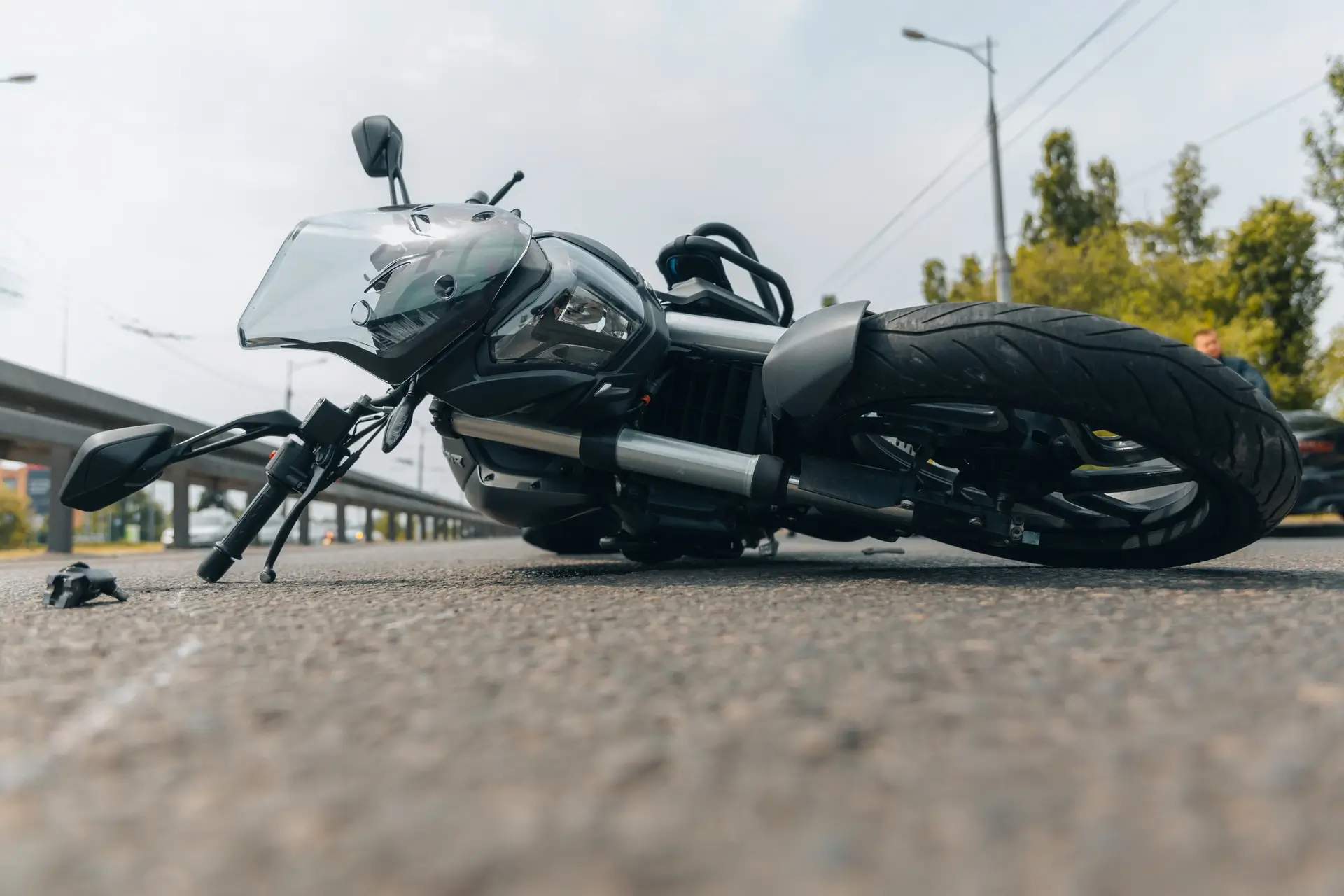 Motorcycle laid on it side in the road
